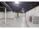 Spacious finished basement with painted walls, fireplace, and ample natural light at 1652 Detroit Nw Ave, Atlanta, GA 30314