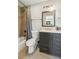 Modern bathroom with gray vanity, tiled shower, and updated fixtures at 1652 Detroit Nw Ave, Atlanta, GA 30314