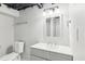 Bathroom featuring a modern vanity, mirror, lighting fixture, and toilet at 1652 Detroit Nw Ave, Atlanta, GA 30314