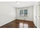 Bedroom featuring hardwood floors, window, and neutral paint at 1652 Detroit Nw Ave, Atlanta, GA 30314