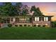 Charming brick home with a covered porch and well-maintained lawn at 1652 Detroit Nw Ave, Atlanta, GA 30314