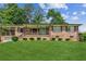 Charming single-story brick home with a covered porch and well-manicured front lawn at 1652 Detroit Nw Ave, Atlanta, GA 30314