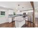 Stylish kitchen with white cabinets, granite countertops, and stainless steel appliances at 1652 Detroit Nw Ave, Atlanta, GA 30314