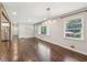 Spacious living room features hardwood floors, natural light, and modern lighting fixture at 1652 Detroit Nw Ave, Atlanta, GA 30314