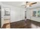 Spacious main bedroom features hardwood floors, connecting to bathroom at 1652 Detroit Nw Ave, Atlanta, GA 30314