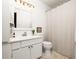 Bright bathroom showcasing a classic vanity and neutral tile floor at 266 Adair St, Decatur, GA 30030