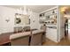 Elegant dining room with built-in shelving, decorative lighting, and a sophisticated color palette at 266 Adair St, Decatur, GA 30030