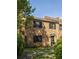 A brick townhome with black shutters, well-kept lawn and manicured landscaping at 266 Adair St, Decatur, GA 30030