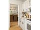 Bright kitchen offers marble countertops, white cabinets, and stainless-steel appliances at 266 Adair St, Decatur, GA 30030