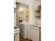 Convenient laundry room with washer, dryer, shelving and brick floor at 266 Adair St, Decatur, GA 30030