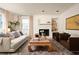 Bright living room featuring stylish decor, a fireplace, and large windows at 266 Adair St, Decatur, GA 30030