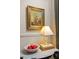 A small table, illuminated by a lamp, features a bowl of apples and art, adding a touch of elegance at 266 Adair St, Decatur, GA 30030