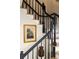 Classic staircase with wooden steps, complemented by art at 266 Adair St, Decatur, GA 30030