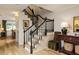 Elegant staircase with wooden steps and black banister at 266 Adair St, Decatur, GA 30030