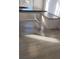 Close-up of dining area featuring sleek, gray tiled floors and built-in seating at 3065 Ashly Pines Dr, Snellville, GA 30078