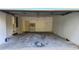 Empty garage with storage cabinet and access door to the side yard at 3065 Ashly Pines Dr, Snellville, GA 30078