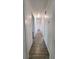 Long hallway featuring tile floors and neutral paint, connecting different areas of the home at 3065 Ashly Pines Dr, Snellville, GA 30078