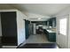 Modern kitchen with stainless steel appliances, gray backsplash, and dark green cabinets at 3065 Ashly Pines Dr, Snellville, GA 30078