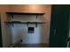 A utility room with storage shelves, modern tile floor and wall laundry connections at 3065 Ashly Pines Dr, Snellville, GA 30078