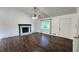 Bright living room featuring a stone fireplace, hardwood floors, and a ceiling fan at 3065 Ashly Pines Dr, Snellville, GA 30078