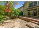 A serene backyard with a stone patio and wooden deck perfect for outdoor living at 1290 Fernwood Ne Cir, Brookhaven, GA 30319