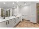Bright bathroom features a double sink vanity with modern fixtures and a glass-enclosed shower at 1290 Fernwood Ne Cir, Brookhaven, GA 30319