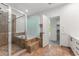 Elegant bathroom showcasing glass-enclosed shower and a separate soaking tub with tile surround at 1290 Fernwood Ne Cir, Brookhaven, GA 30319