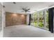 Spacious bedroom with hardwood floors, exposed brick wall, and large windows at 1290 Fernwood Ne Cir, Brookhaven, GA 30319