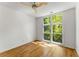 Bedroom with hardwood floors and a large window offering natural light at 1290 Fernwood Ne Cir, Brookhaven, GA 30319