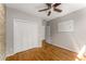 Bright bedroom with hardwood floors, closet, and a whiteboard for convenience at 1290 Fernwood Ne Cir, Brookhaven, GA 30319
