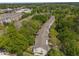 A collection of townhomes are shown nestled among the trees of this community at 1290 Fernwood Ne Cir, Brookhaven, GA 30319