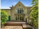 Charming backyard with a deck, brick house, and lush greenery for outdoor enjoyment at 1290 Fernwood Ne Cir, Brookhaven, GA 30319