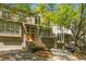 Charming townhome with a brick facade, attached garage, and well-manicured landscaping at 1290 Fernwood Ne Cir, Brookhaven, GA 30319