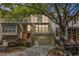 Charming townhome with a brick facade, attached garage, and well-manicured landscaping at 1290 Fernwood Ne Cir, Brookhaven, GA 30319