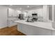 Spacious kitchen island with white countertops and ample cabinet space, stainless appliances at 1290 Fernwood Ne Cir, Brookhaven, GA 30319