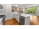 Modern kitchen with white cabinets, stainless steel appliances, and hardwood floors at 1290 Fernwood Ne Cir, Brookhaven, GA 30319