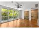 Bright living room featuring hardwood floors, modern railings, and large windows at 1290 Fernwood Ne Cir, Brookhaven, GA 30319
