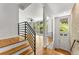 Inviting living room featuring hardwood floors, modern railings, and a cozy atmosphere at 1290 Fernwood Ne Cir, Brookhaven, GA 30319
