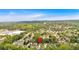 Expansive aerial view of a suburban neighborhood with lush greenery, mature trees, and well-maintained homes in a desirable location at 3463 Chastain Glen Ne Ln, Marietta, GA 30066