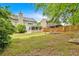 Large backyard with enclosed sunroom, firepit and well-maintained lawn offers great outdoor living at 3463 Chastain Glen Ne Ln, Marietta, GA 30066