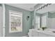 Bathroom featuring double sinks, commode and a window for natural light at 3463 Chastain Glen Ne Ln, Marietta, GA 30066