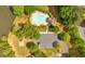 Aerial view of community pool, playground, and parking area surrounded by lush trees at 3463 Chastain Glen Ne Ln, Marietta, GA 30066