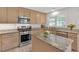 Well-lit kitchen with granite countertops, stainless steel appliances, and island at 3463 Chastain Glen Ne Ln, Marietta, GA 30066