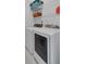 Laundry room with washer, dryer, utility sink and wire rack shelving at 3463 Chastain Glen Ne Ln, Marietta, GA 30066