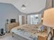 The main bedroom features a ceiling fan, a walk in closet and an attached bathroom at 3463 Chastain Glen Ne Ln, Marietta, GA 30066