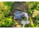 An aerial view of a landscaped property with a charming home surrounded by lush greenery at 4094 Norton Se Pl, Smyrna, GA 30082