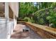 Backyard patio featuring hardscape and retaining wall; perfect for outdoor entertaining at 4094 Norton Se Pl, Smyrna, GA 30082