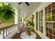 Inviting balcony featuring a ceiling fan, outdoor plants, and views of the surrounding greenery at 4094 Norton Se Pl, Smyrna, GA 30082