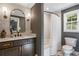 Bathroom with a white tiled shower, white countertop sink, and neutral grey walls at 4094 Norton Se Pl, Smyrna, GA 30082