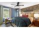 Bedroom featuring a large bed, a window and an accent wall with floral wallpaper at 4094 Norton Se Pl, Smyrna, GA 30082